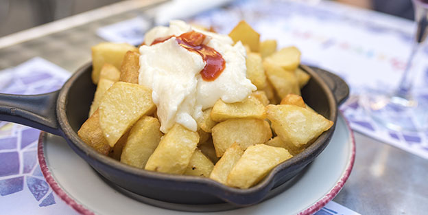 Cuál es el origen de las patatas bravas